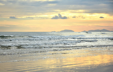 Fototapeta na wymiar Beautiful sea view of gold light reflect with sea wave in twilight time.