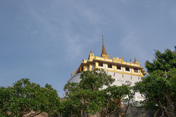 Fototapeta na wymiar Phu-khao-tong temple is history site in Bangkok capital of Thailand about 110 years ago.