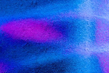 Beautiful bright colorful street art graffiti background. Abstract creative spray drawing fashion colors on the walls of the city. Urban Culture, black ,blue, purple , violet , neon texture