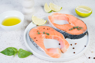 Raw marinated red fish in spices, lime and olive oil in a white plate. Close up