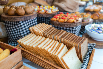 Fototapeta premium Assortment of fresh bread on table in buffet