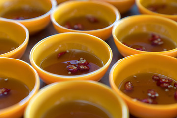 Many bowls of Vietnamese fish sause, the important food in Vietnam