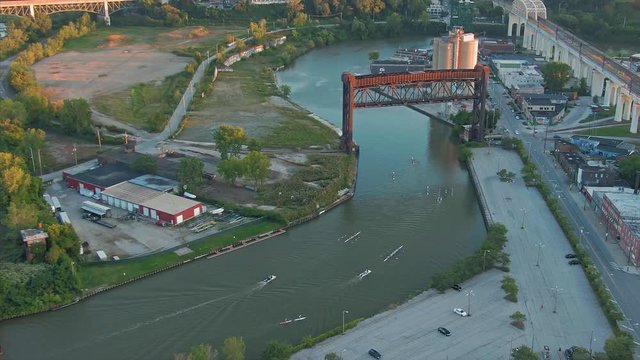 Aerial: People rowing on the Cuyahoga river. Cleveland, Ohio, USA. 17 September 2019