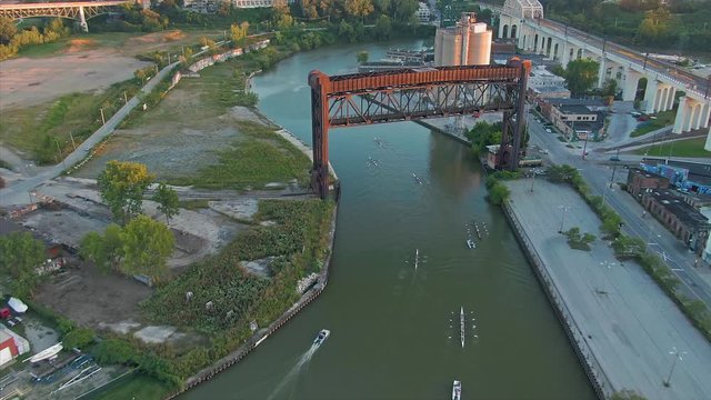 Aerial: People rowing on the Cuyahoga river. Cleveland, Ohio, USA. 17 September 2019