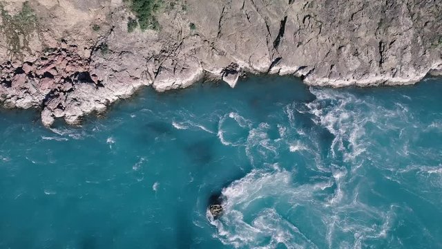 Aerial overhead shot of water rapids in a canyon in the south of New Zealand.