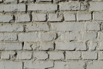 White masonry wall painted with lime.