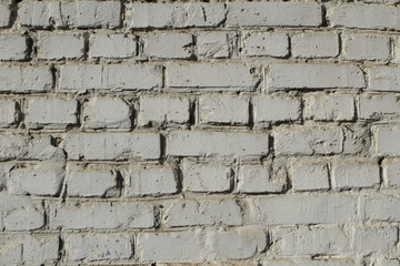 White masonry wall painted with lime.