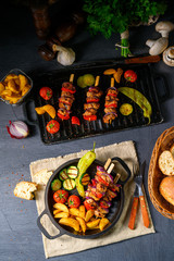 Shish kebab with various vegetables and spice country potatoes