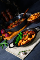 Rib of pork with beans and quarter potato