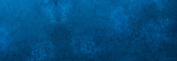 Fototapeta na wymiar Dark slate background toned classic blue color. Long banner. Old textured background