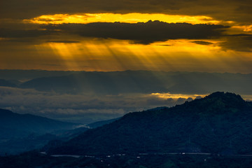 Fototapeta premium Natural background,high angle that overlooks blurred scenery from fog, rain that flows through,sees Buddha images,temples,mountains,is a viewpoint while traveling in Phetchabun,Khao Kho,Thailand