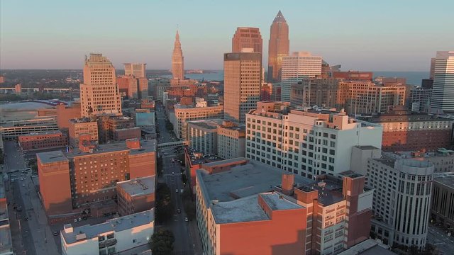Aerial flying over Cleveland city at sunrise, Ohio, USA