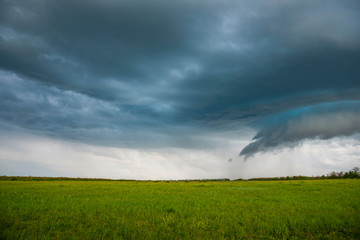 Fototapeta na wymiar Spring landscape with a stormy sky