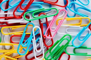 Heap of colorful paper clips.