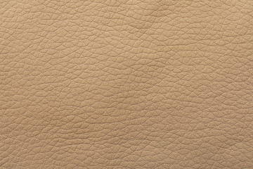 Texture of beige leather as background, closeup