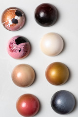 Colorful modern chocolate bonbon truffles on marble