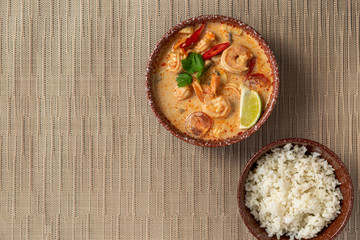 Ceramic bowl of Tom Young soup with shrimp