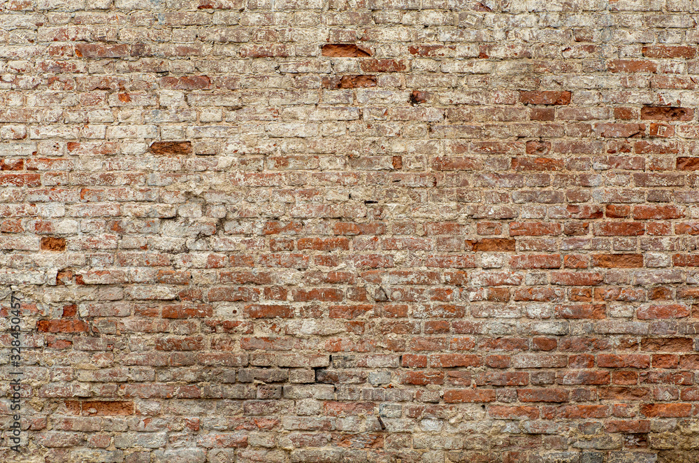 Wall mural old brick wall. brickwork from an old brick in a rustic style. the structure and pattern of the dest