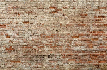 Fototapete Ziegelwand Alte Backsteinmauer. Mauerwerk aus einem alten Ziegelstein im rustikalen Stil. Die Struktur und das Muster der zerstörten Steinmauer. Platz kopieren