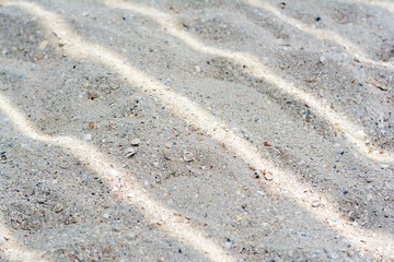 Sand in the shade, sand background texture. Close up Nature Beach Sand Soft Texture In Summer Sun. 