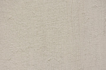 The surface with cracks of paint applied on the concrete wall