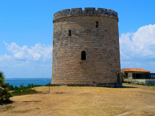 Fototapeta na wymiar An old stone watchtower in Varadero, Cuba