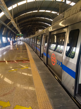 Delhi Metro train full view with empty platform during morning time in Delhi India