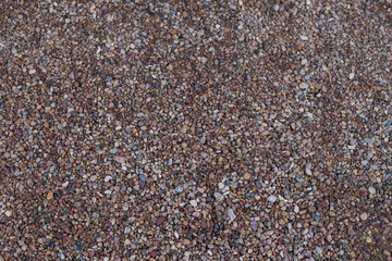 Small multi-colored river stones. Background with place for text