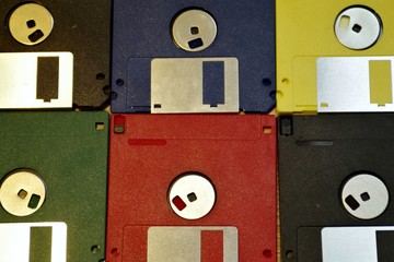 Retro Computering Memory Storage. Vintage Floppy Diskettes three inch and a half, old equipment for...