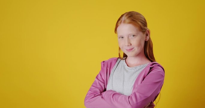 Slow Motion Portrait of White Confident Teenager Crossing Her Arms
