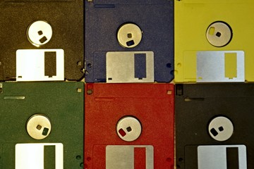 Retro Computering Memory Storage. Vintage Floppy Diskettes three inch and a half, old equipment for...
