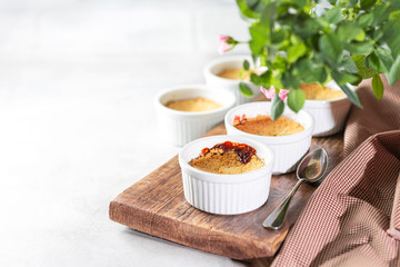 Crumble with cherry on a light background.