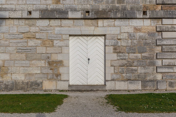 Wall background of old buildings with wooden door