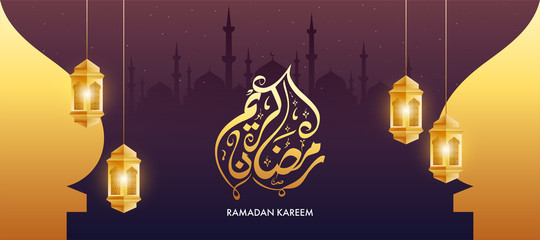 Arabic Calligraphy of Ramadan Kareem Text with Hanging Golden Illuminated Lanterns on Mosque Starlight Brown Purple Background.