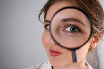 Young beautiful woman portrait looks painful eye lens search on Internet information employer does...