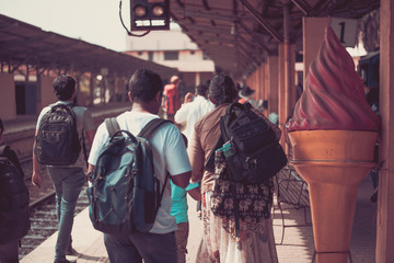 People locals and tourists go on 1 track of the railway station platform in Galle Sri Lanka