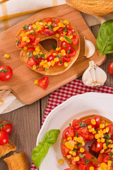 Friselle with tomatoes and mais.	