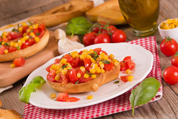Friselle with tomatoes and mais.	