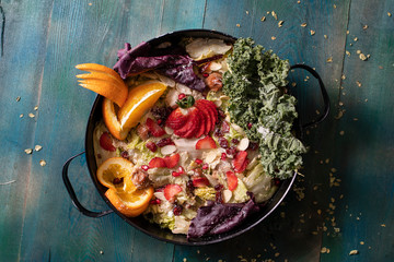 Green salad with colored fruits