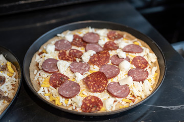 the salami pizza before cooking