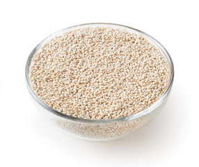 Dried white quinoa seeds in glass bowl isolated on white background with clipping path