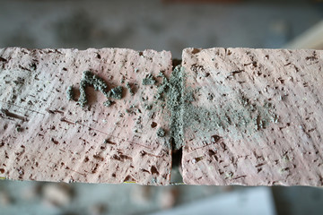 Focus on great construction leveled with special string made of lasting and strong materials. Focus on professional masonry strewed with concrete dust. Building concept