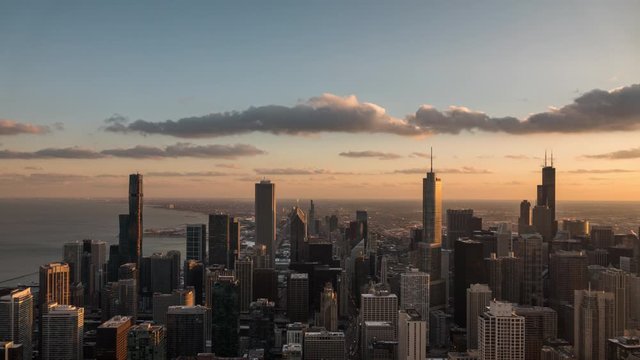 Day to night time lapse looking South at the Chicago skyline with passing clouds flowing by.