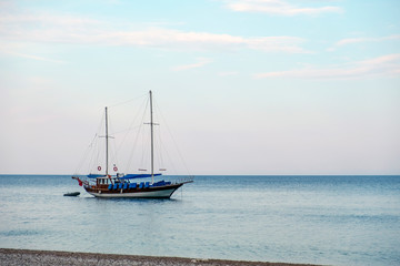 Fototapeta premium Old sailing boat is standing anchored near the coast.
