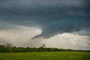 Obraz na płótnie Canvas Spring landscape with a stormy sky