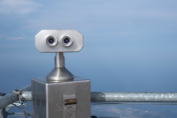 Close up of observation binoscope or binoculars on top of tahtali mountain with mountains and...