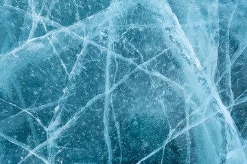 Cracks in the ice. Frozen lake surface.