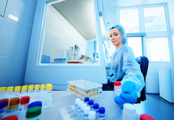 a female scientist makes PCR DNA tests in a modern chemical and bacteriological laboratory.