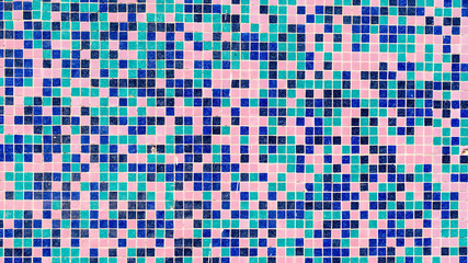 Retro looking old mini tiles on a wall.