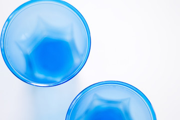 Disposable blue cups flat lay. Round abstract shapes. Selective focus